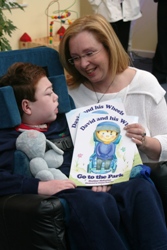 David's mum Heather shows him the book he inspired her to write.